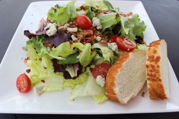 Wedge Salad · Romaine lettuce, cherry tomatoes, bacon, and bleu cheese crumbles.