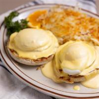 Eggs Benedict  · Two poached eggs and Canadian bacon on an English muffin, topped with Hollandaise sauce. Ser...