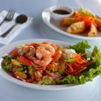 6. Yum Talay · Shrimp, mussels and calamari mixed with lemon glass, onions, lime juice and fish sauce.