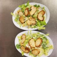 Grilled Chicken Caesar Salad · Caesar salad topped with grilled chicken.