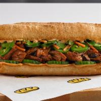 Bánh Mì · Soy glazed pulled pork, sliced cucumbers, pickles carrots, jalapenos and fresh cilantro, wit...