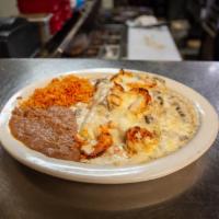 Shrimp Enchiladas Lunch · White cheese enchiladas topped with sauteed shrimp and topped with mushroom sauce. Served wi...