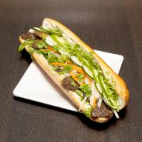 Regular Vegan Beef Sandwich · Choice of vegan meats, lettuce, pickled carrots and jicama, cucumber, vegan, mayo, jalapeno ...