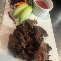 A5. Grilled Marinated Steak Bite · Served with Thai chili lime dipping.