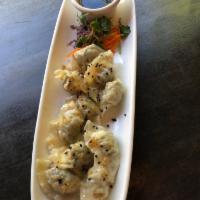 A7. Steamed Chicken Dumplings · 10 pieces. Served with lemon soy sauce.