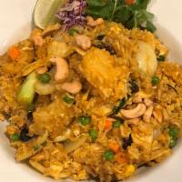 D94. Pineapple Fried Rice · Comes with choice of meat or tofu and fried rice with eggs, pineapples, onions, raisins, pea...