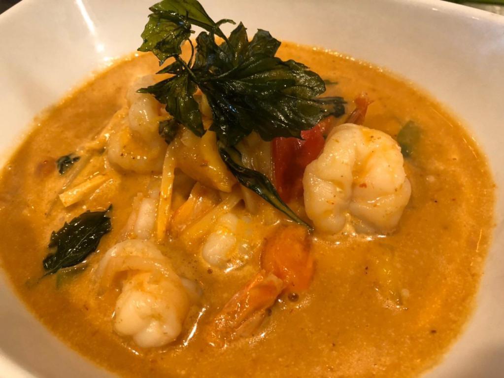 D55. Pineapple Curry · Red curry paste cooked with coconut milk, pineapple, bell peppers, bamboo shoots and Thai basil.