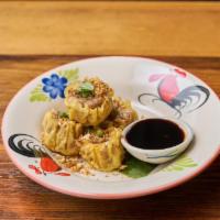 Kanom Jeeb · Steamed or fried dumpling filled with minced chicken. 
