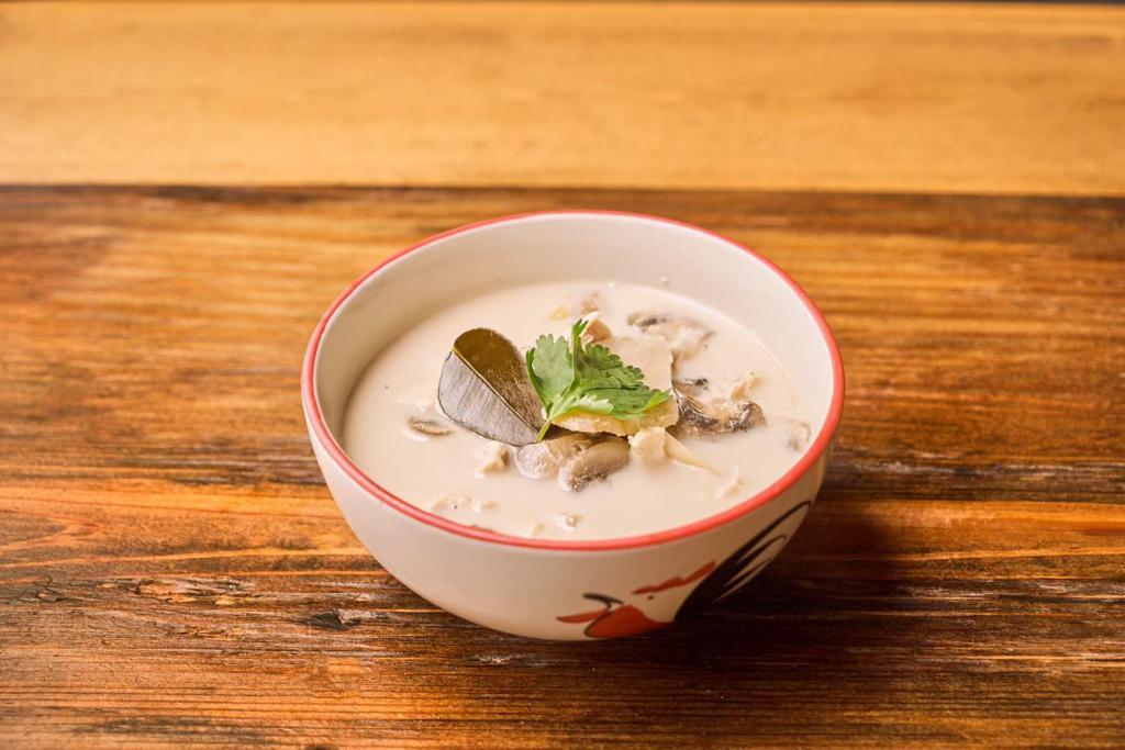 Tom Kha Gai · Herbed chicken coconut soup with mushroom and galangal. 