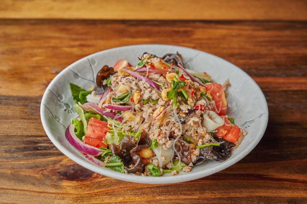 Yum Woon Sen · Spicy glass noodles salad with shrimp, minced pork and chili mixed with onion, peanut and lime juice. 