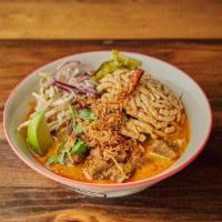 🌶 Khao Soi Stewed Beef · Northern style curry noodle soup with stewed beef, pickle, cilantro, red onion, dried chili,...