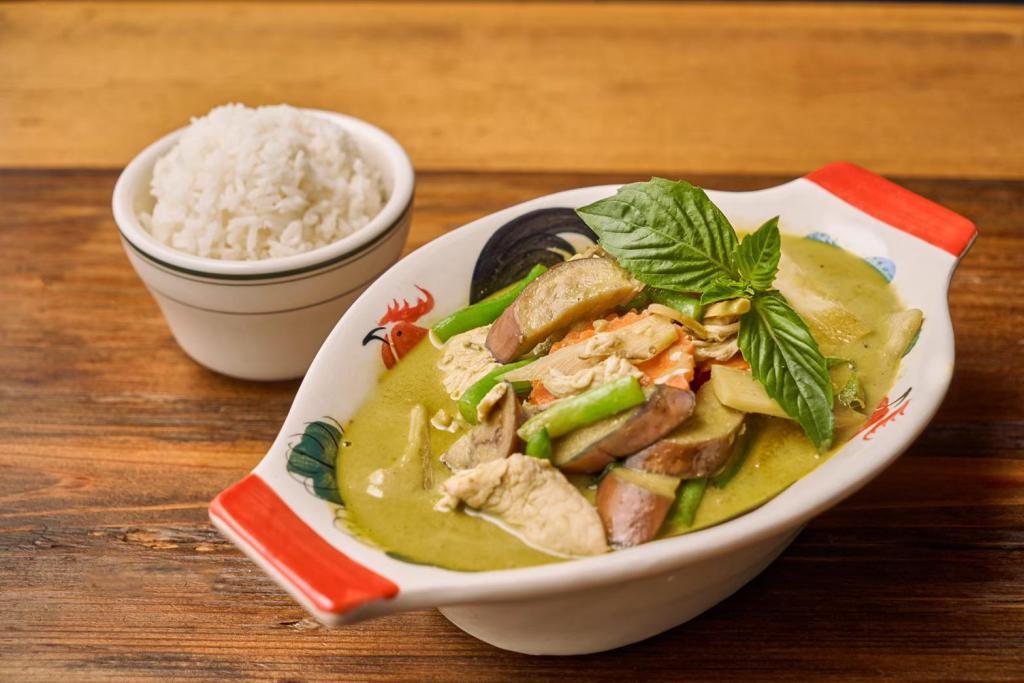 🥇Gaeng Kiew Warn 🌶 · Thai style green curry with bamboo shoot, basil leaves, carrot, eggplant, green bean and bell pepper simmered in coconut milk.