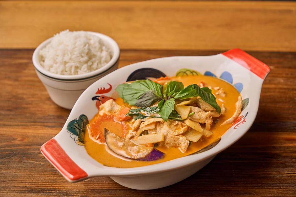 Gaeng Dang 🌶 · Thai style red curry with bamboo shoot, basil leaves, carrot, eggplant and bell pepper simmered in coconut milk.