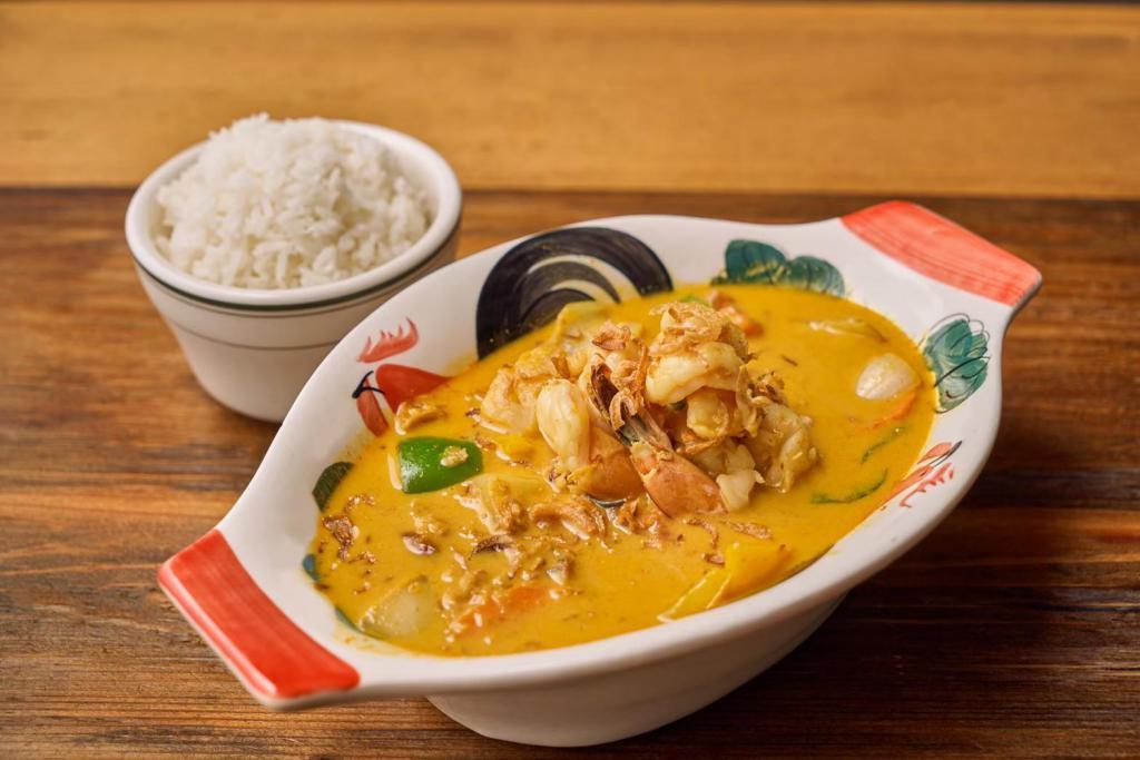 Gaeng Karee · Yellow curry paste with tomato, potato, bell pepper and onion simmered in coconut milk. 