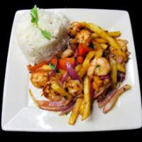 41. Saltado de Camarones · Sauteed shrimp with onions, cilantro, tomatoes, green onions and french fries, served with r...