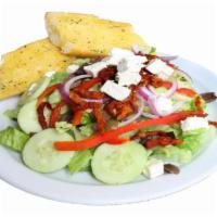Greek Salad · Romaine lettuce, red onions, Greek olives, red bell peppers, sun-dried tomatoes, feta cheese...