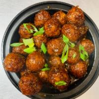 Vegetable Machurian · Vegetarian deep fried balls tossed with soya sauce based gravy cooked to chef's perfection.