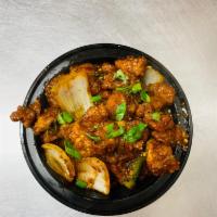 Chilli Chicken · Stir-fried chicken with sweet pepper, green chilies, onions and aromatic Indian herbs.