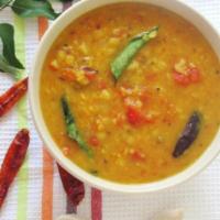 Tomato Pappu · Lentil cooked with tomatoes, onions, chillies and tempered with garlic and mustard.