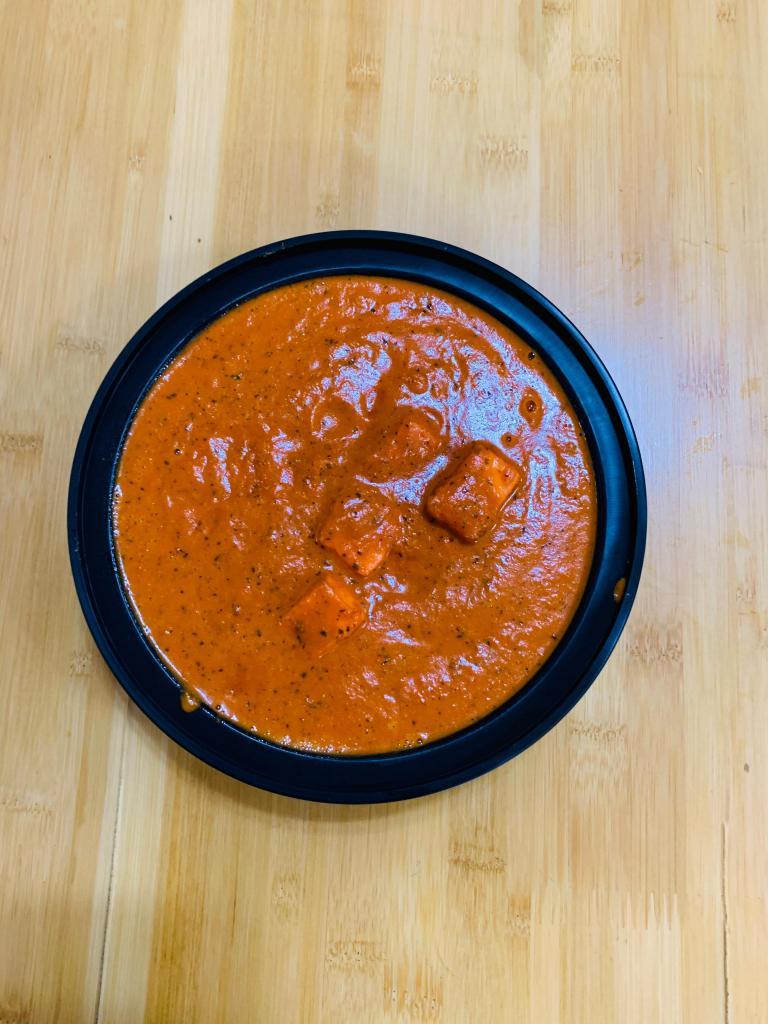 Paneer Tikka Masala · Cottage cheese cooked in cream and tomato gravy with combination of onion, peppers and tomatoes.