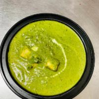 Palak Paneer · Simmered spinach with exotic spices added with cottage cheese.