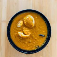 Anda Curry · Boiled eggs cooked with homemade mild tangy gravy.