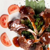 Lamb Chops · Served in plum soy marinade. Served with soup or salad, and steamed rice.