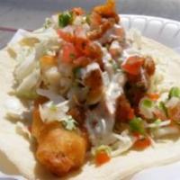 Fish Taco · Beer battered served on corn tortilla with lettuce, cabbage, salsa fresca, homemade white sa...