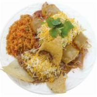 Chicken Enchilada · Shredded chicken wrapped in corn tortilla topped with our homemade red enchilada sauce, chee...
