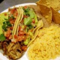 No 7. Fish Tacos Combo · 2 fish tacos rice and beans on the side.