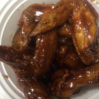 13. Chicken Wing with Sticky Sauce · Cooked wing of a chicken coated in  sauce or seasoning.
