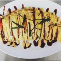 Omelette · Stir-fried noodles or fried rice wrapped in an omelette.