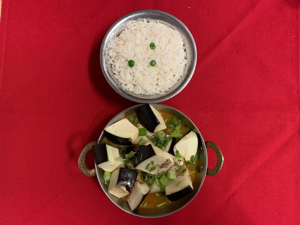 Aloo Bhanta (Eggplant & Potato) · Eggplant and potatoes cooked in himalayan style curry sauce. Served with basmati rice. Vegetarian.