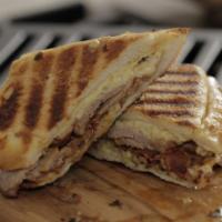 BLVD Cuban Sandwich · slow roasted pork, prosciutto, Emmental swiss, pickled cukes, mustard