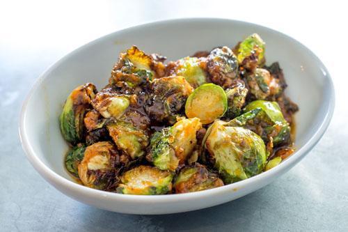 Spicy Sprouts · Oven roasted brussel sprouts, Vermont maple syrup, red chili sauce. Gluten free. Dairy free. Vegan. Spicy.