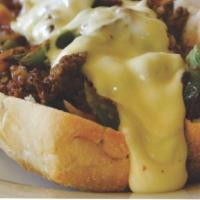 49. Philly Cheese Steak and Fries · Philly steak, mushroom, onion, green peppers and cheese.