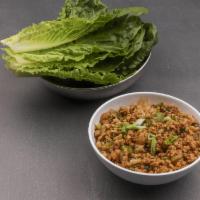Chicken Lettuce Wraps · Crisp chilled romaine lettuce for wrapping around tasty chicken, water chestnut, scallion, o...