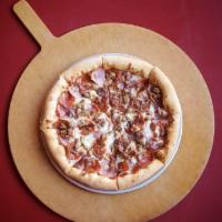 Meateater Pizza · Smoked ham, pepperoni, bacon, and Italian sausage with mozzarella and smoked provolone cheese.