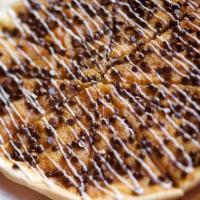 Chocolate Chip Pizza · Crispy thin crust, cookie dough, chocolate chips, and icing. 