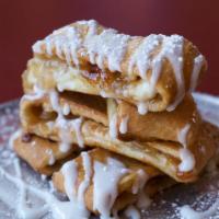 Apple Strudel · Apple filling wrapped in our hand-tossed original crust with cinnamon, sugar, and icing. 