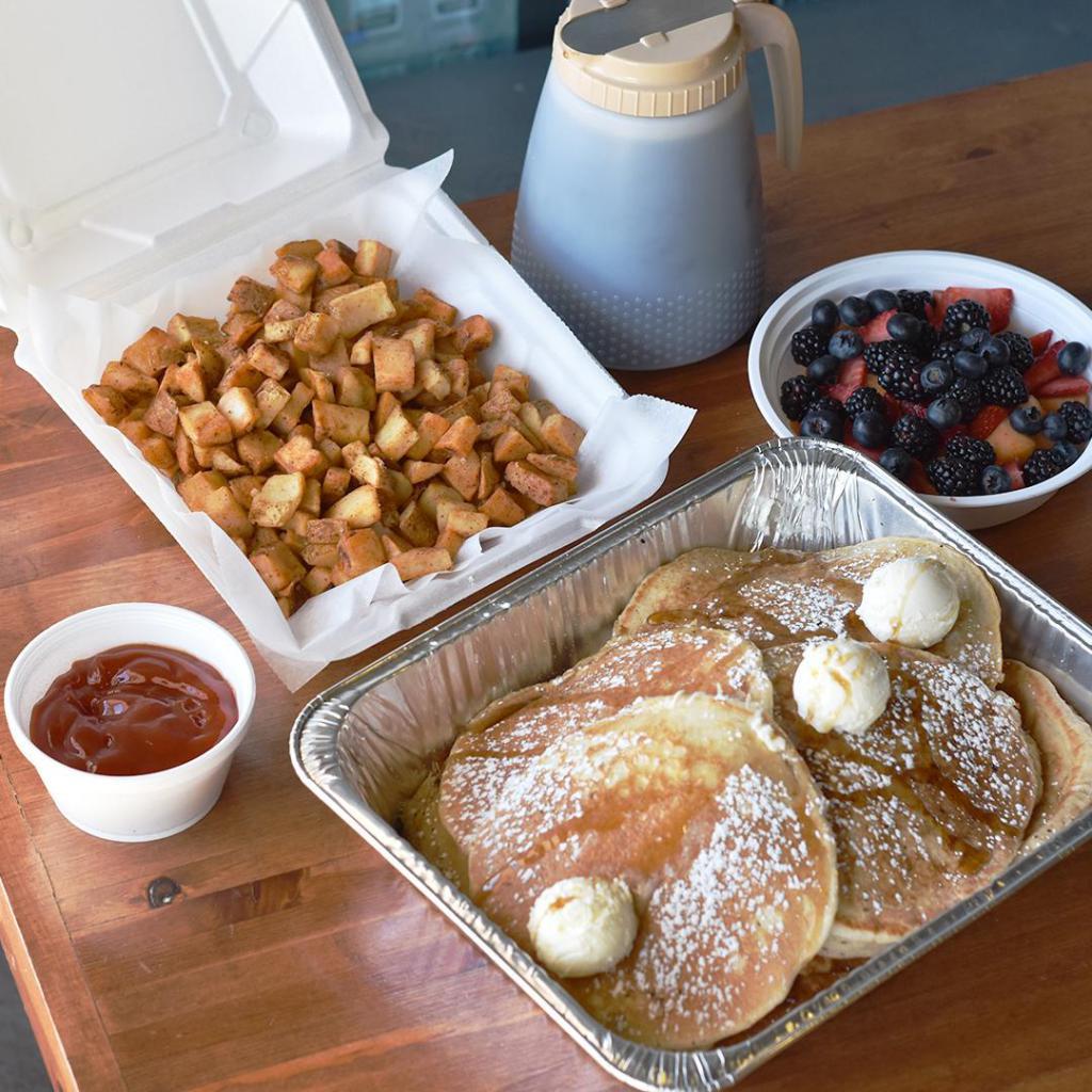 Pancake Family Meal · This meals comes with 10 fluffy pancakes served with butter, syrup and choice to add Strawberries or Chocolate Chips.  Also served with choice of 2: potatoes, applewood smoked bacon or fruit bowl.  Potatoes are served with ketchup.