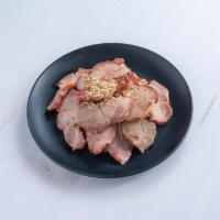 Barbecued Pork · Slices of tender pork and first marinated then barbecued. Served with Chinese mustard.