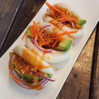 A15. 3 Piece Avocado Bun · Homemade steamed bun rolled with avocado, red onion, carrot, crushed peanuts and peanut sauc...
