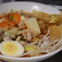 N5. Oppa Noodle Soup · Korean-style kimchi egg noodle soup with pork, steam tofu, onion, scallion, mushroom, carrot...