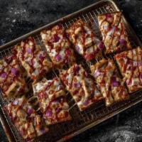 Large BBQ Chicken Pizza · Premium mozzarella, grilled chicken, bacon, red onions and BBQ sauce.