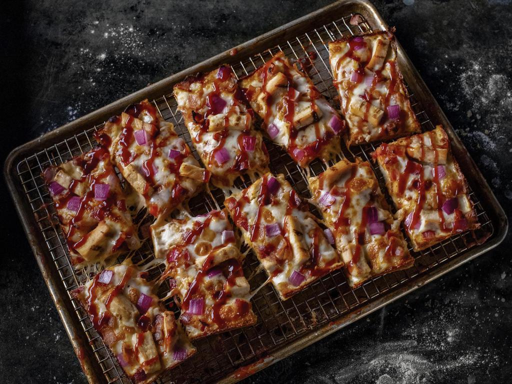 BBQ Chicken Pizza · Premium Mozzarella Cheese, Grilled Chicken, Bacon, Red Onions, and Sweet Baby Ray's BBQ Sauce.