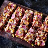 4 Corner Hawaiian Pizza · Premium mozzarella, ham, bacon and pineapple. 4 pieces deep dish.