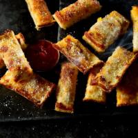 12 Piece Jet's Triple Cheese Turbo Stix · Deep dish pizza dough freshly baked with premium mozzarella and cheddar, topped with b
tter,...