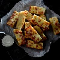 12 Piece Deep Dish Bread · Deep dish pizza dough freshly baked with premium mozzarella, topped with butter, garlic and ...
