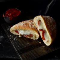 Jet's Boat · Freshly baked pizza dough stuffed with premium mozzarella and your favorite pizza toppings, ...